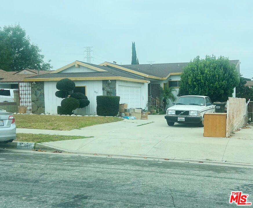 Welcome to 1237 W. 124th Street! This charming 4-bedroom, 3-bath home in Los Angeles is hitting the market for the first time in 60 years and offers an amazing opportunity to make it your own. With some work needed, this property has incredible potential! The walk-in level includes a spacious living room, bonus room, kitchen, plus 1 bedroom and 1 bath. Downstairs, you'll find 3 more bedrooms, a cozy den, and an additional bathroom. Don't miss this rare chance to create your dream home in a prime location!