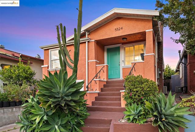 View of front of house featuring stucco siding and entry steps