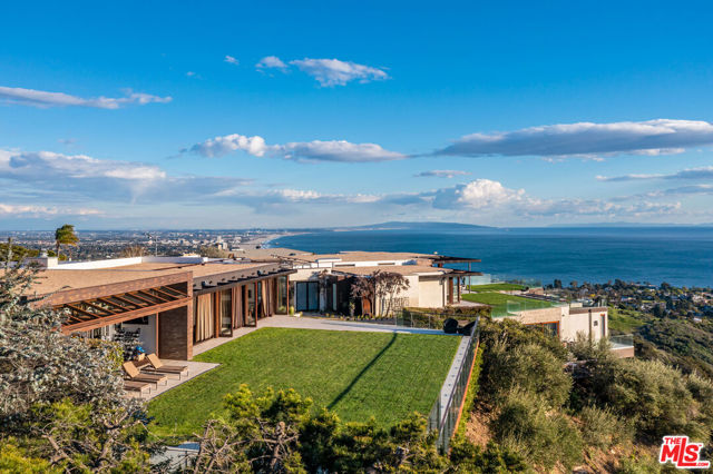 "Live the Dream" World Class/Coastal Modern- designed by legendary Ardie Tavangarian, this offering is unique in every way. Sited on 2 lots combined, the setting offers the finest Ocean Views in the city. This most special compound offers over 11,000sqft on 1.3 acres. Located at the end of prestigious cul-de-sac, minutes to Palisades Village and the beaches. A masterful Zen oasis featuring 7 bedrooms and 11 baths. Additional features include: screening room, epic gym with automated walls of glass, wellness center, 4-car garage and large flat grassy yard for entertaining and infinity edge pool. Rare offering for a buyer who wants unparalleled views, design and craftsmanship.