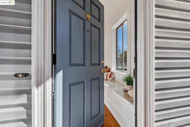 Foyer entrance with dark wood-style flooring