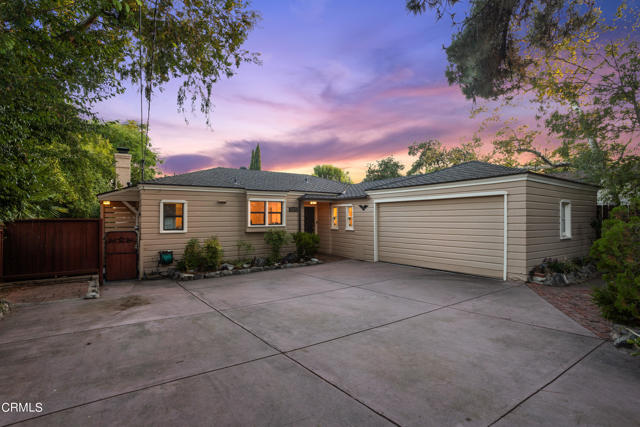 This charming Traditional, built in 1937, is located on a quiet street in a highly sought-after neighborhood close to the foothills. Its classic floor plan flows seamlessly and features three bedrooms, two and one-half baths, spacious living room and updated kitchen with breakfast bar and adjacent laundry room. The gracious primary suite, complete with tastefully remodeled bathroom and generous closet space, opens onto a covered balcony that offers views of the valley and distant hills. Additional amenities include beautiful hardwood floors, tiled fireplace, newer windows, central heat & air, copper plumbing, fresh interior and exterior paint and an attached two-car garage. In the rear, there is a separate studio well-suited for use as a guest room or office, plus a large storage room with built-in shelving. The fully fenced yard is private and serene with drought-tolerant plantings and ample space for gardening and play. Here is a wonderful opportunity to own a turnkey home in an award-winning school district.