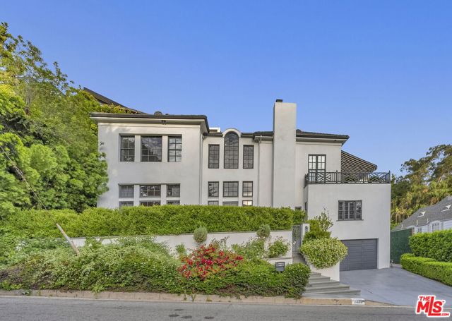 1460 N Doheny Drive Los Angeles, California Welcome to this exquisite property located in the highly sought-after and picturesque area of Doheny Estates Area. The gated front ensures privacy and security as you enter the grand entrance with its beautiful, curved staircase adorned with Hollywood Marble. No expense has been spared after the complete stud-out remodeling of this estate. The top-of-the-line cabinetry, LED lighting, and sumptuous tile work in the bathrooms create a lavish atmosphere. The chef's kitchen features marble countertops, a large center island and high-end appliances. The decorative light fixtures, wall sconces, and chandeliers, all supplied by Restoration Hardware, perfectly complement the estate's design. The luxurious owners' suite is a haven of relaxation, featuring breathtaking views of the ocean on the balcony and a spa-like en suite with Calcutta marble and a steam shower. The owners' suite walk-in closet offers both practicality and elegance, complete with a safe room. With a total of 6 bedrooms, with most offering en suite bathrooms, and walk-in closets with custom cabinetry. This residence offers an additional 500 square feet of living space (not included on title), ideal for a guest suite or office. The private backyard is an oasis, featuring an auto-pool cover system, dancing fountains, and a spacious grassy lawn for kids to play with privacy. This property in the Doheny Estate area is a true masterpiece, boasting elegance, luxury, and an ideal location. With its impeccable design, meticulous attention to detail, and a wide array of high-end features, this home offers a truly exceptional living experience.