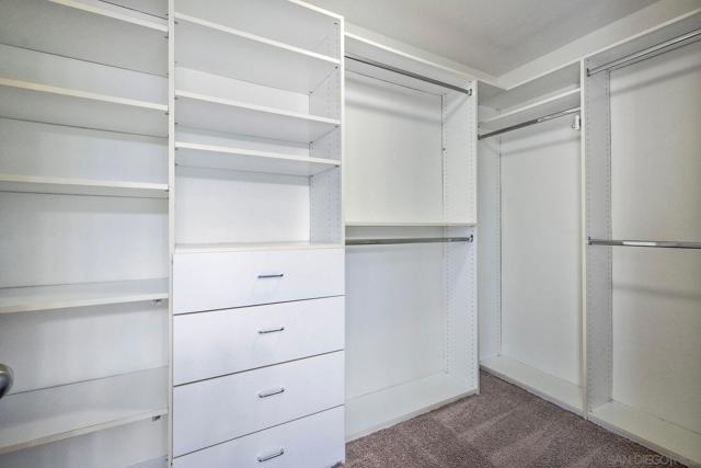 Spacious walk in closet in primary bedroom