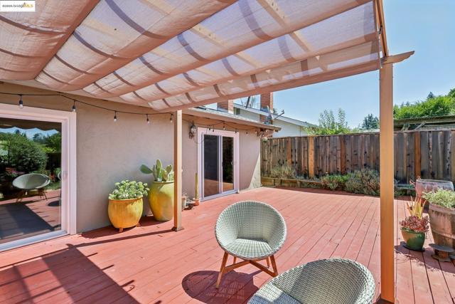Wooden terrace featuring a pergola
