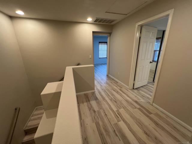 STAIRS TO SECOND LEVEL LOFT FOR OPEN OFFICE WORK AREA BETWEEN THE TWO MASTER SUITES.