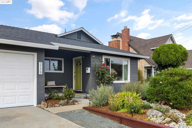 View of front of home with a chimney, a shingled roof, and stucco siding