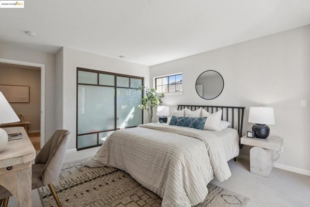 Carpeted bedroom featuring baseboards
