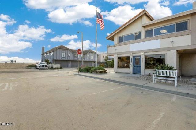 Double lot - corner location - commercial 2 story building with beautiful ocean views!!  3 entrances into the building - one off Los Altos Street and two off Ocean Drive.  Six private parking slips located on the property.