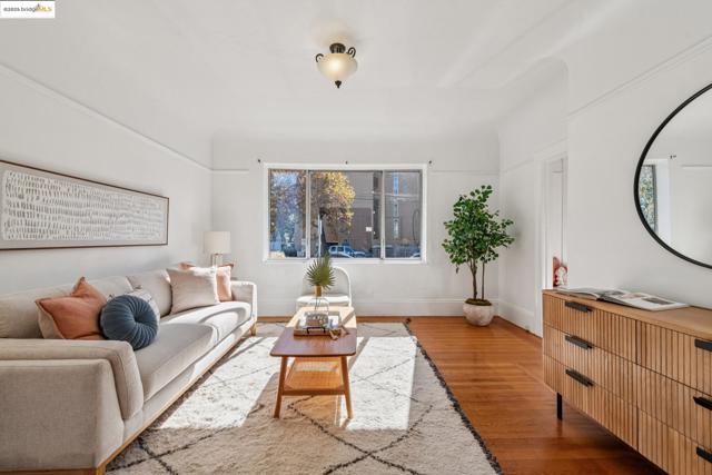 Living area featuring wood finished floors and baseboards