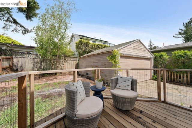 Back deck off the primary bedroom and detached garage.