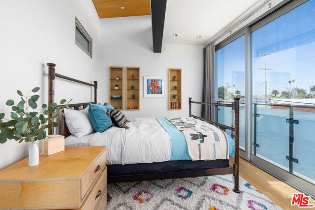 Bedroom offers electric semi-blackout blinds and private balcony & infinity sliding doors