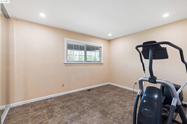 Workout area featuring baseboards and recessed lighting