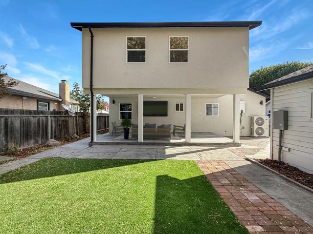 View of Yard To Virtually Staged Backyard Patio Area