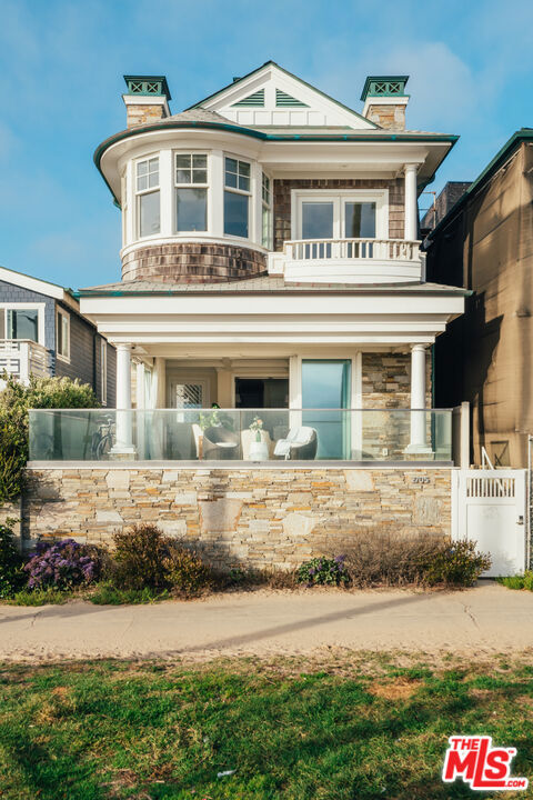 2705 OCEAN FRONT Walk Venice, California Welcome to this incredible beachfront property offering a rare opportunity to own a charming Hamptons-style home in chic Venice Beach. This unique, oceanfront oasis was designed by famed architect Ian Harrison with sliding walls of glass and multiple balconies, all enveloped by unobstructed ocean views. The open floor plan gives way to the balcony for a highly sought-after indoor/outdoor lifestyle. The elegant gourmet kitchen is appointed with breakfast nook, Thermador appliances, six-burner range, espresso machine, pantry, and more. The decadent master suite has its own private balcony, fireplace, lounge, walk-in closet, and Calacatta marble bath with dual vanities, tub, and glass shower. A bonus space awaits on the first floor, optimal for a cinema/media room, playroom, gym, or more. Relax or celebrate on the spacious roof deck with fireplace, barbecue, and kitchenette. Additional amenities include guest suites with balconies, laundry room, powder room, elevator, and outdoor shower. Offered perfectly move-in ready, sold with furnishings, linens, and silverware! A Venice dream, this residence is located just moments to the area's trendy shops, boutiques, restaurants, recreational activities, and burgeoning nightlife.