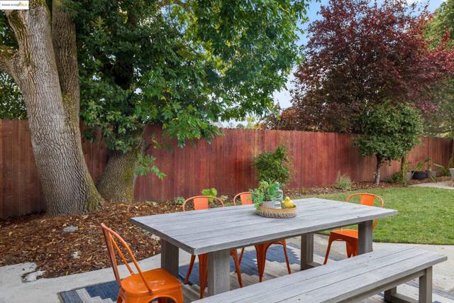Outside kitchen door, outdoor patio dining area.