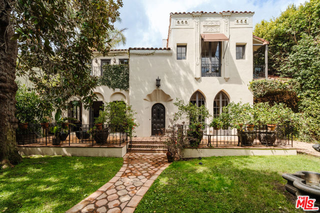 Nestled in the heart of Los Feliz, the Dr. M. Scholtz residence, built in 1925, is a testament to the timeless elegance of Spanish Colonial Revival architecture, thoughtfully designed by the brilliant Louis Kons & Brim. This exquisite home spans 3,670 sq ft on an 8,402 sq ft lot, offering 6 bedrooms and 3 bathrooms of unparalleled charm and history, as well as pool and hot tub. Built with meticulous attention to detail, this property has been lovingly maintained and updated, blending historical authenticity with modern luxury. The home underwent a comprehensive renovation in 2014 and has recently been refreshed featuring newly painted interiors, refinished hardwood floors, and updated light fixtures that highlight its unique character.The spacious living room, with its large custom concrete fireplace, integrated built-in storage, and a bookcase with a rolling library ladder, flows seamlessly into the dining area, which is adorned with built-in floor-to-ceiling shelves, and original lighting fixtures. Both rooms feature intricately stenciled designs in the wooden ceiling beams as well as French doors that enhance the open feel, leading to a tranquil front patio with custom Spanish tiles and a soothing fountain. The property continues to impress with a beautifully landscaped pool and hot tub set against Saltillo tiles by Arto Brick, providing a private oasis for relaxation and entertainment. The kitchen boasts expansive amenities, including a large space with a custom-built breakfast table and butcher block. It features a built-in wine rack, plentiful counter space, and high-end appliances like a Sub-Zero refrigerator, Wolf range, and Fisher & Paykel dishwasher, complemented by a Miele washer and dryer. Additionally, the kitchen offers multiple doors leading to the backyard, enhancing flow and accessibility.The home, where history meets luxury, boasts a fully functional, restored phone booth - a nod to its rich past. Also hidden behind a bookshelf, is a secret closet revealing the home's prohibition-era history, once used for the discreet storage of alcohol. The primary bathroom is a masterpiece of design and craftsmanship, featuring a custom-made steam shower crafted from the windows of an old warehouse in downtown LA, offering a spa- like retreat within the comfort of your home. The house features a fully automated driveway gate as well as a gated entry with an intercom system which ensures privacy and security, set back from the tree-lined street.Located in the prestigious Los Feliz neighborhood, you can find a variety of neighborhood features. The area, part of the Greater Griffith Park neighborhood, offers trendy restaurants and boutique shops such as Home Restaurant, The Dresden, All Time, and Little Dom's, as well as convenient markets including Lazy Acre. Notable nearby attractions include Griffith Observatory and Fern Dell Nature Trails in Griffith Park. Don't miss your chance to experience the luxury, history, and beauty of this exceptional Los Feliz estate.