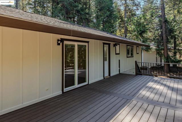 Deck featuring view of scattered trees