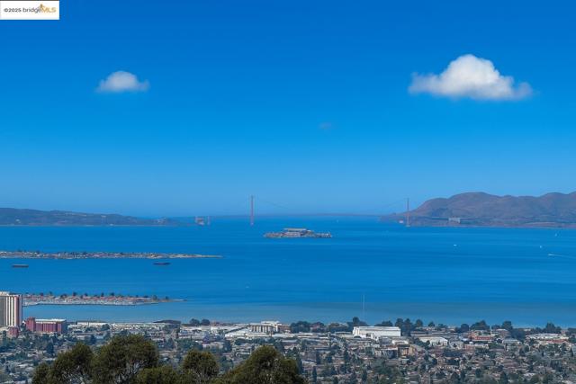 Water view with a mountainous background and nearby urban area
