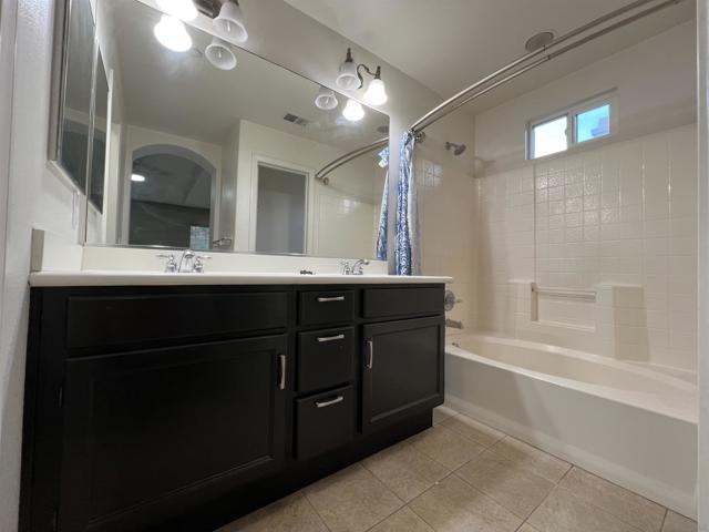 BATHROOM WITH BATHTUB IN MASTER SUITE BEDROOM 2.