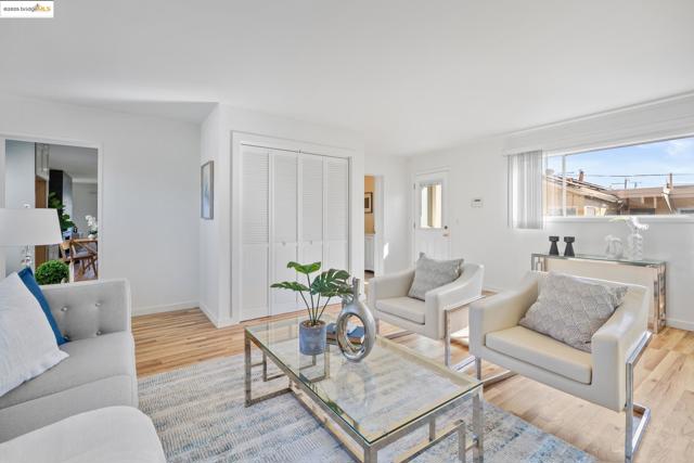 Living room featuring light wood finished floors and baseboards