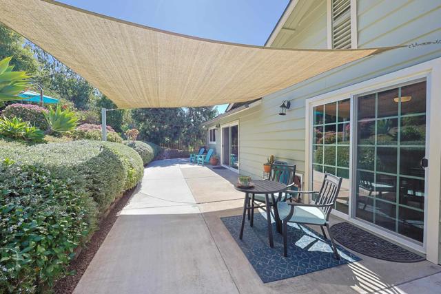 backyard lower area with a canopy shade