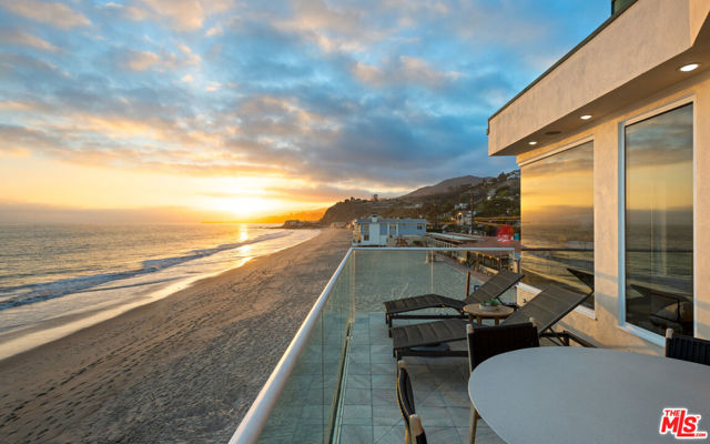 Located on the coveted La Costa beach, this Architectural home is an entertainer's paradise with breathtaking unobstructed westward views. Situated on a wide sandy section of beach, far from public access, this home offers a contemporary Malibu sanctuary.  Inside high ceilings and an abundance of natural light provide a relaxing environment to enjoy the open concept floor plan. Vaulted, tray ceilings and a corner fireplace add to the ambiance of the living area with expansive ocean views through the full-length windows that lead out to an expansive deck with dining area and built-in barbecue.  A commercial-grade kitchen inspires the creation of culinary delights. Granite countertops provide plenty of prep space with additional island seating. A sub-zero refrigerator, double ovens, a 6-burner Viking stove with a grill, and instant hot water ensure cooking is a pleasure. The owner's suite offers ocean views, built-in cabinetry, an ensuite bath with imported stone, a soaking tub with water views, dual vanities, and a large shower. Additionally, the master closet boasts plenty of space for your wardrobe.  Two additional bedrooms with full baths. Large family room upstairs features a wet bar, Sonos sound system and custom built-ins, making it the perfect room to view your favorite movies. Two-car garage with a half bath and direct access to the beach. This home is in a prime location with no HOA. The close proximity to shopping, dining and sought-after amenities make this Malibu estate a perfect 10! Schedule your showing today.