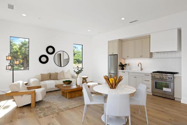 Great room of detached guest home with full kitchen, laundry area and one bedroom one bathroom.