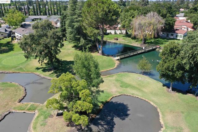 Drone / aerial view of a large body of water and a tree filled landscape