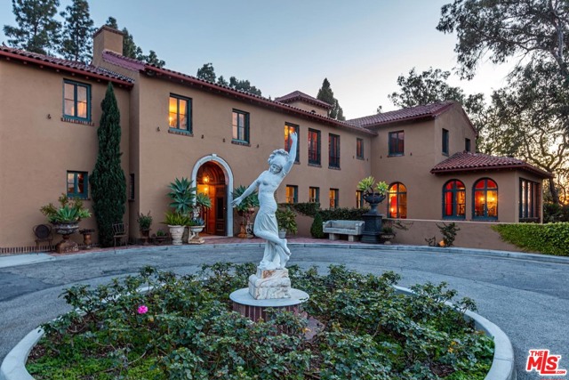 1923 Micheltorena Street Los Angeles, California The newly repriced Paramour Estate provides a once-in-a-lifetime opportunity to own a prestigious trophy property rich in Hollywood history with an intricate identity all its own, formed over decades dating back to the entertainment industry's Golden Age. Crowning the top of the Moreno Highlands in Silver Lake, the mansion boasts unrivaled 360-degree vistas of DTLA, the Hollywood Sign, San Gabriel Mountains, and to the far west, the Pacific Ocean. Originally commissioned by an oil heiress, the 3.4-acre estate was designed by renowned architect Robert D. Farquhuar. Enter the walled compound through ornate iron gates to be welcomed by a dramatic driveway that ascends to a circular motor court adorned with a garden of roses. The stunning main house offers numerous vibrant guest suites, an expansive ballroom with 25-foot-high ceilings and adjoining bar, formal dining, opulent living with separate sunroom enclosed by soaring windows overlooking the landscape, and a lower-level kitchen/staff quarters. Wander the sweeping grounds enveloped by lush greenery, take a dip in the marble hand-tiled pool, dine al-fresco on one of the many patios, or host visitors in the multiple guest cottages. Prepared for its next chapter, this historic property is a rare Los Angeles jewel with the city's most captivating views and multiple possibilities, previously having been used as residences and even a girls' school.