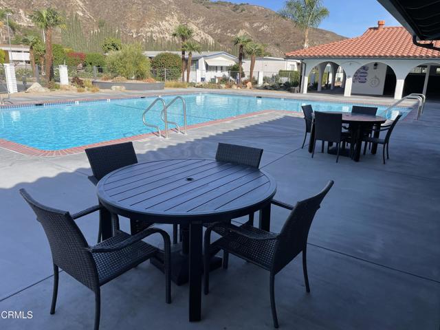 Pool with shaded tables