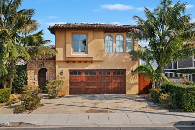 A Ventura 'Keys Island' water front home! Enter this beautiful Mediterranean Tuscan style Villa through an arch stone gated portico into the private serine moss and stone courtyard and water fountain. Enter through the massive wrought iron and glass double doors onto the brushed marble flooring throughout the main level of this spacious two-story 3 bedroom 4 bathroom home.  At the entry is a spacious Office/Media room with built in cabinetry and sliding Alder wood/glass double doors. The living room has wood beamed ceilings, recessed lighting, Alder wood/glass double French doors with sidelight doors that open approx. 12 ft. to a waterfront retreat with an entertainment deck and a large approx. 38 ft. boat dock. Cozy up in the living room with a beautiful hand carved marble fireplace and a secret temperature controlled wine cellar complimenting the open floor plan of the living room and dining room. The dining room also has double doors that open to the waterfront deck and features a custom made built in China cabinet with etched glass doors and mood lighting with dimmers. The kitchen features rain forest marble counter tops and spacious center Prep Island with Alder wood custom cabinetry and prep sink. Gourmet Chef kitchen appliances includes Fisher & Paykel dishwasher, Wolf convection oven and microwave, a stove Pot Filler Wall Faucet above a Wolf electric induction stove top with extra quiet range hood and a Sub-Zero refrigerator. On the second level are 3 bedrooms and bathrooms. The spacious primary suite features his and her walk-in closets, spacious primary bathroom with soaking tub encased in marble and hand carved stone tiles and wood plantation window shutters. Adjoining the primary bedroom is a room with skylights, Marble fireplace, built-in entertainment center, book shelves, wine refrigerator and custom draperies. The 2 additional spacious bedrooms each have their own large full bathrooms. High efficiency heating and air system extra fine micro filter for air system filtration for allergy control plus energy recovery unit. A Laundry room with Whirlpool washer and dryer. A sun/workout room with skylights and auto blinds on the windows. The top floor distressed hard wood pecan flooring has two layers of soundproofing under the wood flooring. A 75 gallon water heater. A Sound System throughout both floors. Home is earthquake engineered with steel plates. Ring doorbell and Security camera's. Cemented Redland Clay Tile Roofing.