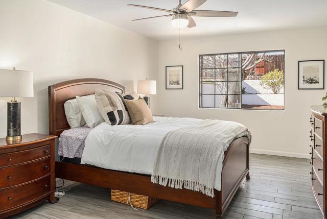 Large primary bedroom with premium wood grain plank tile