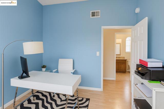 Office featuring light wood-style flooring and baseboards