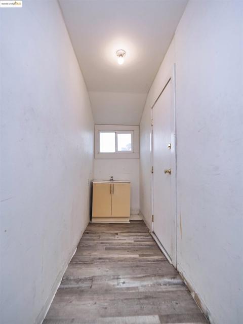 Empty room with light wood finished floors