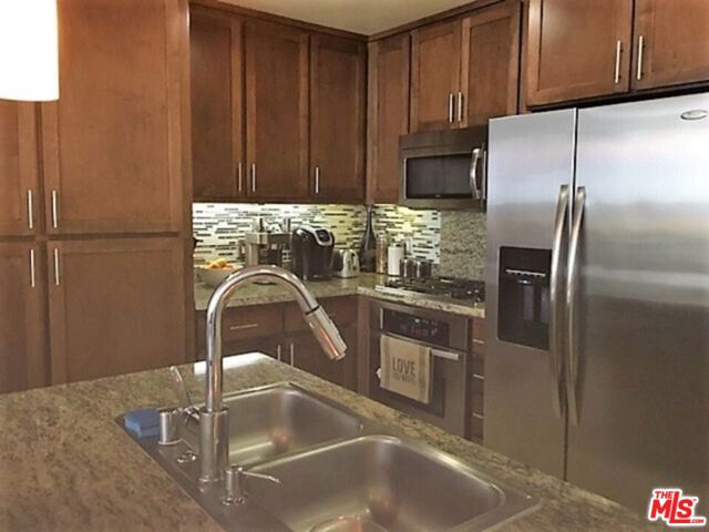 21301 ERWIN Street, Woodland Hills CA: https://media.crmls.org/mediaz/d126b258-2af9-4d6f-ae55-e46d1284b6f2.jpg