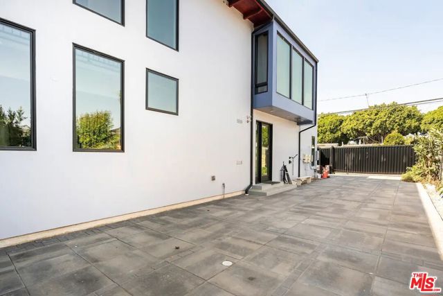 Backyard area with plenty of area to park or charge your car with the EV charger