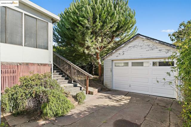 Detached garage with concrete driveway