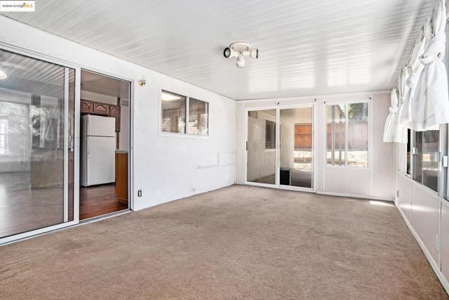 Unfurnished sunroom with healthy amount of natural light