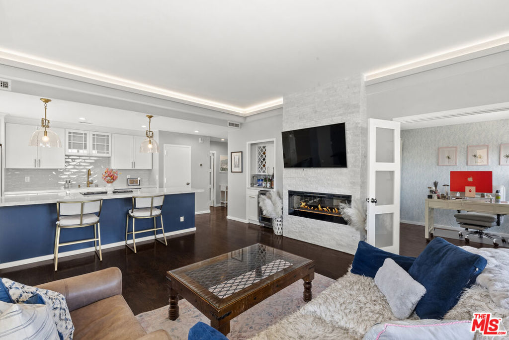 One of the Best View Corner Units at Franklin Towers now available! Move into this incredibly remodeled Stunning home with open floor plan and 180 degree views of LA City, Hollywood and West to Century City and beyond with a wrap around balcony including New In unit Laundry, Massive Lux Huge Spa Like Rain Shower in Primary, Stack Stone Electric Fireplaces in Primary and Living Room, Custom GE Cafe Kitchen Appliances, Custom Cabinetry,  Hardwood floors throughout Living, Dining and Guest Bedroom, New Fleetwood Sliding Doors and Windows, Smart appliances including Nest Thermostat System, Built in Murphy Bed in Guest Bedroom/Office/Den, Built in Wet Bar and accessories closet and more! Building amenities include 2 parking spaces across from the elevator, Heated Pool, Spa, Sundeck, Exquisite Roof Top Fitness Room and Sundeck, Valet, 24 hour Door Personnel and more. A Rare Offering Indeed!