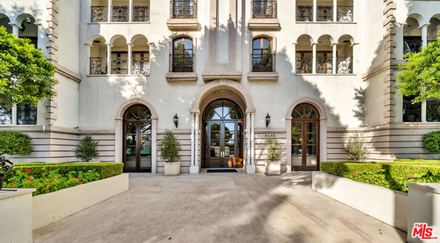 This beautifully maintained luxury condo is located in the prestigious "La Faubourg St. Germaine'' building on Burton Way next to L'Hermitage Hotel.  Situated on a beautiful and tranquil tree-lined street in the heart of Beverly Hills, this 2bd/2.5 bath condominium has an open floor plan and two separate bedroom suites on opposite sides of the unit offering additional privacy.  A gorgeous updated chef's kitchen look opens up to the family and living room spaces which are elegant and sophisticated yet comfortable. Numerous French doors open to Juliet balconies throughout, letting in the beautiful outdoors with a Parisian feeling.  A combination of hardwood flooring and tile with custom moldings throughout add to the elegance of the space, complete with its own private laundry, cozy fireplace and a sizable balcony.  Elegant two-story grand lobby, gym, side by side gated parking with ample guest parking, a separate and large storage space for the individual unit, and a wonderful doorman/concierge onsite during the weekdays make this one of the most coveted buildings in BH.