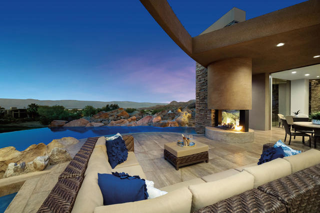 This Timeless contemporary home is tucked above the 2nd green of BIGHORN'S Mountain course, offering dramatic down-valley views. Created by architectural designer Guy Dreier, this residence includes four generous suites plus a media room with bar, and a fifth suite currently being used as an office/study. Pocketing walls of glass open to create indoor/outdoor living with the great room, kitchen and family rooms. The dramatic 'lounge bar' is the perfect place to entertain, with soft seating, fireplace views of the valley and golf course. The master retreat offers high ceilings and access to the private patio and spa. The master bath includes two vanities, two lavs, two large walk-in closets, sunken tub, oversized glass shower with direct access outside to the outdoor shower and spa. Stunning setting.  Offered furnished.