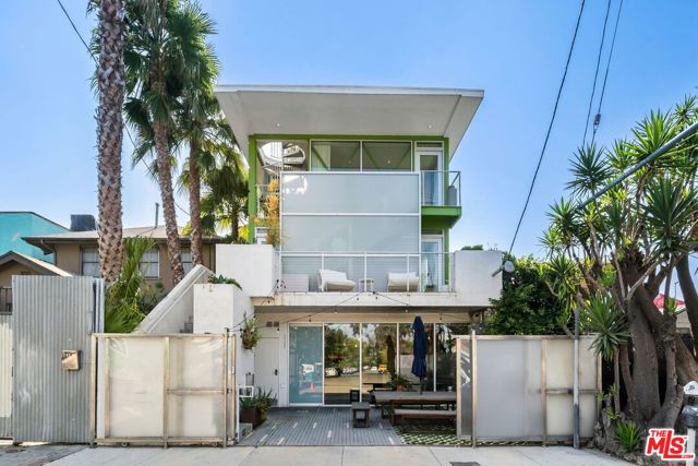 1312 Innes Place Venice, California Nestled in the heart of Venice, this distinguished mixed-use building, recently built in 2009. Positioned along the vibrant Main Street, this three-story architectural masterpiece, uniquely constructed from 14 shipping containers, houses a dynamic blend of two residential units and a ground floor commercial space. The ground level is a modern 300-square-foot office, complemented by a spacious outdoor patio for versatility and comfort. Ascending to the second and third floors, you'll discover two light-filled and picturesque units. The middle unit offers a 2-bedroom, 1.5-bath layout, while the top unit boasts a 1-bedroom and 1.5-bath configuration. Among the property's most captivating features is its expansive rooftop deck, offering unrivaled panoramic vistas that perfectly capture California's golden hour sunsets. This property, with its contemporary allure, embodies the infectious energy of Venice, delivering a remarkable urban living experience in one of Los Angeles' most artistically vibrant neighborhoods.