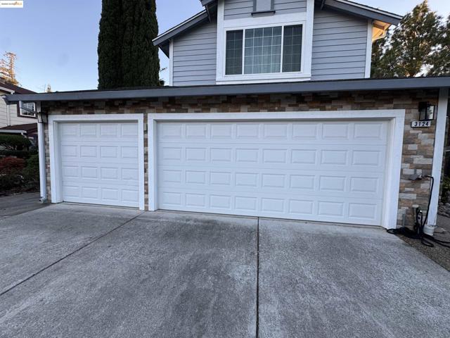 Garage with concrete driveway
