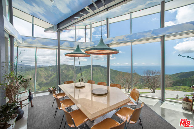 Escape in your own back yard. Openness, without those barriers that limit the expansive feel. Seclusion provided by a remote location and gated drive. This Malibu home that gives you no separation anxiety from your cars/toys. Although stunning in design and location, the Owners enjoy how comfortable the home is to live in and entertain. Architectural, Iconic, One Of A Kind Primary Home or The Ultimate Get-A-Way. There is much to know and appreciate, call for more information. "The Cloud House". Architects, George Wittman & Hagy Belzberg, created this extraordinary modern masterpiece, which was 4 years in the making, with recently extensive upgrading.  The home is meticulously designed to optimize magnificent vistas with walls of glass comprising the perfect paradise for Malibu indoor/outdoor living. The estate consists of the main house with a gallery and office (currently displaying autos, but could serve as an art gallery, studio, gym or owner specific), pool & spa, a 6 plus car garage, additional exterior parking, and separate guest house. The process of exploring the possibility of an additional garage is underway. Recent refreshing included; window upgrades and replacements, HVAC systems, roofing, solar panels, Tesla batteries, and generator. There is a well with water storage tanks. Sited on 32 private acres, adjacent to parkland, with views of Boney Ridge and to the Pacific Ocean & Leo Carrillo. Is it too hot, or too cold in the winter where you are? Try this climate zone of the Pacific Ocean and Malibu Mountains. Located only 3+ miles off Pacific Coast Highway.  Convenient to the Camarillo airport. A private retreat for a Collector, Musician, Artist, Writer,.. you.