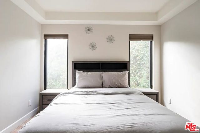 Downstairs bedroom #1 with a queen bed and ensuite bathroom