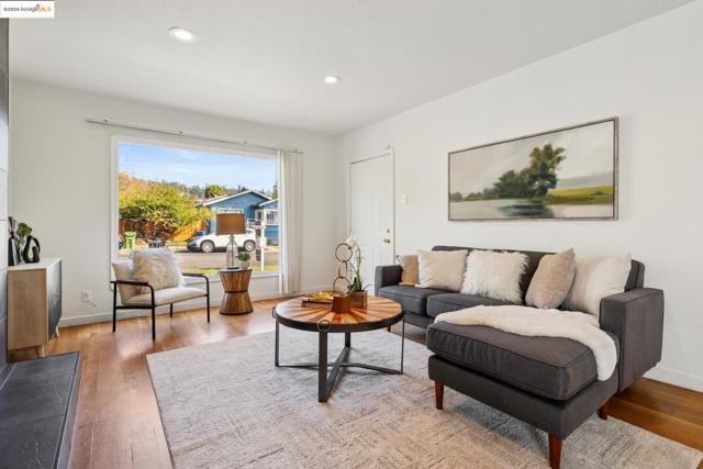 Living area with recessed lighting and wood finished floors