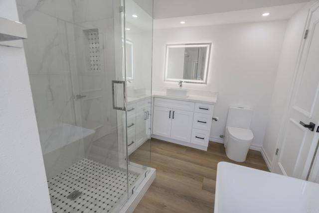 EZ access to YOUR tastefully designed:   Custom Tiled Walk In Rainhead Shower.  Yes, PLEASE!