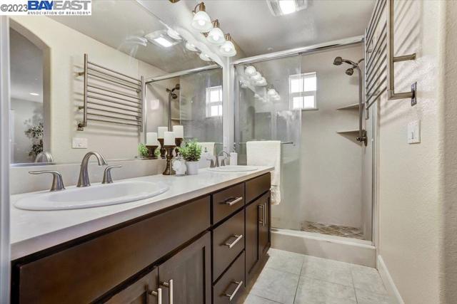 Master bathroom with spacious shower and dual-sink vanity