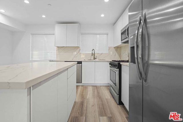 2125 S Rimpau Boulevard, Los Angeles CA: https://media.crmls.org/mediaz/d7c1e820-69c8-4a05-bb81-7d6eb4b87ee9.jpg