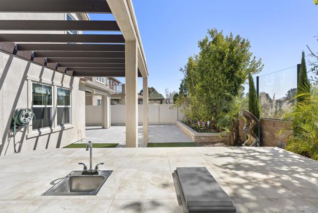 Pergola and built-in planters and fountain